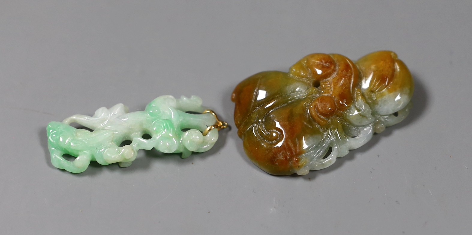 Two Chinese jadeite carvings, one mounted as a pendant, largest 4.7 cm